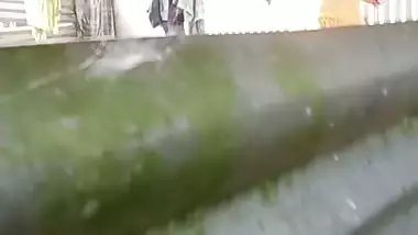 Neighbor Bengali aunty bathing outdoor caught on camera
