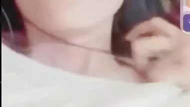 Smiling girlfriend video call to boyfriend shows boobs