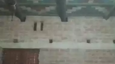 Village girl applying lotion to full nude body